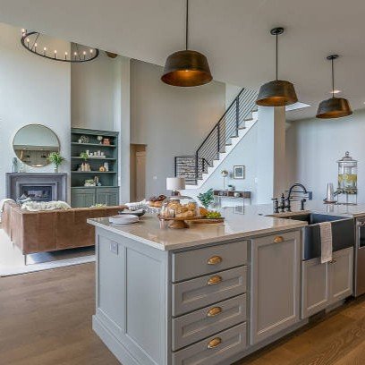 Kitchen island with gray and white colors staged for Tour